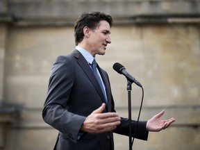 Canadian Prime Minister Justin Trudeau speaks with the media in London on Sunday, May 7, 2023. Trudeau says he doesn't expect his government to move on electoral reform, despite his party membership calling for a national council to examine the issue.