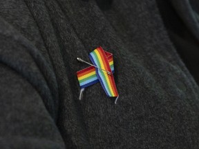 A person wears a pin at a Pride meeting at Norwich and District Museum in Norwich, Ont., on Wednesday, May 3, 2023.&ampnbsp;An Ontario catholic school board has voted against a motion to fly a Pride flag outside its main office in Aurora, Ont.