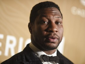 FILE - Jonathan Majors arrives at the American Black Film Festival Honors on March 5, 2023, at 1 Hotel in West Hollywood, Calif. Majors was confronted Tuesday, May 9, with a revised domestic violence charge stemming from a woman's allegations that the Marvel star twisted her arm, struck her head and shoved her into a vehicle in New York City in March.