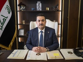 FILE - Prime Minister Mohammed Shia al-Sudani sits for a portrait in his office in Baghdad, Iraq, Wednesday, March 1, 2023. Mohammed Shia al-Sudani on Saturday, May 27, 2023, announced plans for a $17 billion regional transportation project intended to facilitate the flow of goods from Asia to Europe.
