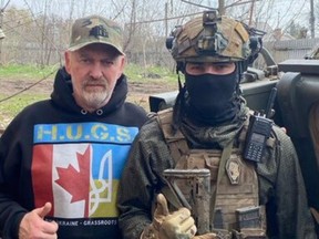 Aid worker Paul Hughes with a Ukrainian soldier west of Bakhmut, Donetsk, Ukraine.
