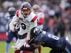 Montreal Alouettes wide receiver Jake Wieneke (9) is tackled by Toronto Argonauts defensive back DaShaun Amos (8) after making a catch during first half CFL Eastern Final football action in Toronto on Sunday, November 13, 2022. He's adjusting to a new team and new offence in Saskatchewan but Wieneke doesn't have to worry about developing a chemistry with his quarterback.