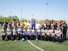 Soccer players gather for a group photo in a CF Montreal handout photo. The MLS club is introducing a women's program to the CF Montreal Academy, the club announced Wednesday.
