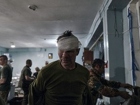 A wounded Ukrainian soldier after receiving first aid at a medical stabilisation point near Bakhmut, Donetsk region, Ukraine, Thursday, April 27, 2023.