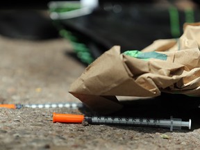 Needles on the sidewalk outside of a downtown Toronto safe injection site.
