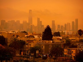 A hazy San Francisco skyline as a result of wildfires is seen from Dolores Park in San Francisco, California on September 9, 2020.