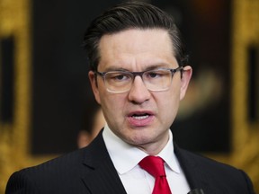 Conservative Leader Pierre Poilievre speaks to reporters in the foyer of the House of Commons on Parliament Hill in Ottawa on Tuesday, May 16, 2023.