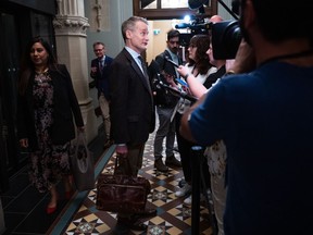 Labour Minister Seamus O'Regan speaks to reporters before heading to a caucus meeting on Parliament Hill in Ottawa, on Wednesday, May 10, 2023.