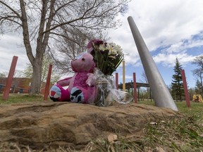 A mother and 11-year-old child were fatally stabbed on Friday, May 5, 2023, near Crawford Plains School. A person matching the description of their attacker was shot by police. A memorial was set up on the school grounds on Saturday, May 6, 2023.