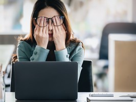 A woman who is ageing from stress holds here eyes behind her glasses. Thankfully, a new study says that the effects of stress on age may be reversed.