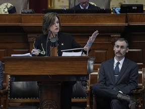 Rep. Andrew Murr, R - Junction, Chair of the House General Investigating Committee, right, listens as Rep. Ann Johnson, D - Houston, Vice Chair, speaks during the impeachment proceedings against state Attorney General Ken Paxton in the House Chamber at the Texas Capitol in Austin, Texas, Saturday, May 27, 2023. Texas lawmakers have issued 20 articles of impeachment against Paxton, ranging from bribery to abuse of public trust as state Republicans surged toward a swift and sudden vote that could remove him from office.