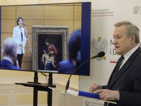 Poland's culture minister, Piotr Glinski, right, adresses the media during a press conference in Warsaw, Poland, Wednesday, May 31, 2023. Glinski said that a precious 16th century painting "Madonna with Child," attributed to Alessandro Turchi, that was looted from a private Polish collection by Nazi Germany during World War II has been found in Japan and returned to Poland's ownership.