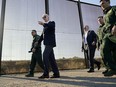 FILE - President Joe Biden walks along a stretch of the U.S.-Mexico border in El Paso Texas, Jan. 8, 2023. The Biden administration has requested 1,500 troops for the U.S.-Mexico border amid an expected migrant surge following the end of pandemic-era restrictions.