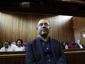 FILE - Former Mozambican finance minister, Manuel Chang, appears in court in Kempton Park, Johannesburg, South Africa, on Jan. 8, 2019. Chang faces imminent extradition to the U.S. to face corruption charges after spending four years in a South African prison. Chang was in 2018 arrested in South Africa on a U.S. warrant of arrest for charges related to his role in a $2 billion debt scandal that plunged Mozambique into a financial crisis when it was uncovered in 2016.