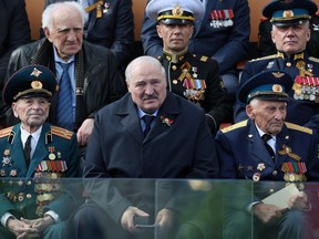 CORRECTS DATE - Belarusian President Alexander Lukashenko, centre, watches the Victory Day military parade marking the 78th anniversary of the end of World War II in Red square in Moscow, Russia, Tuesday, May 9, 2023.