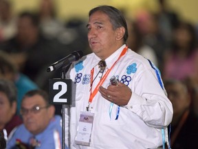 Chief Dean Sayers, of the Batchewana First Nation in Ontario, addresses the audience as Indigenous leaders from across Canada attend the Assembly of First Nations' 35th annual general meeting in Halifax, Thursday, July 17, 2014.&ampnbsp;Leaders of the Robinson Huron Treaty Litigation Fund say they've reached a proposed $10-billion settlement with the governments of Ontario and Canada over unpaid annuities for using their lands.