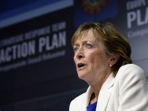 Newly released documents say the intelligence community's relationship with its key watchdog have been "particularly strained" over the last year due to a "level of resistance" to scrutiny. Marie Deschamps, speaks at a news conference in Ottawa on Thursday, April 30, 2015.