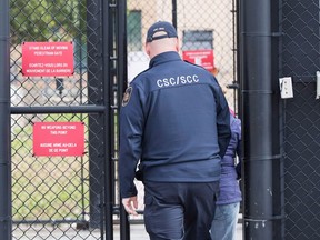 A correctional officer enters the gate at Millhaven Institution in Bath, Ont., on Wednesday Oct. 17, 2018. Paul Bernardo's transfer to a medium-security prison almost two decades after his conviction is not unusual, says a Quebec criminology professor who studies sexual murderers.