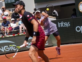 Canada's Bianca Andreescu, rear, and New Zealand's Michael Venus play a shot against Japan's Miyu Kato and Germany's Tim Puetz during their mixed doubles final match of the French Open tennis tournament at the Roland Garros stadium in Paris, Thursday, June 8, 2023.