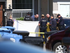 Police investigate a shooting in the 100 block of Everwoods Court S.W. on Thursday, Aug. 18, 2022.