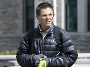 Hassan Diab leaves a vigil with supporters, Friday, April 21, 2023 in Ottawa.&ampnbsp;&ampnbsp;The Liberal government should undertake a "comprehensive reform" of Canada's extradition law as soon as possible to prevent "further injustices" due to shortcomings, recommends a House of Commons committee.