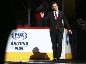 Former Arizona Coyotes hockey captain Shane Doan waves to fans as he arrives during his jersey retirement ceremony prior to an NHL hockey game against theWinnipeg Jets, in Glendale, Ariz.,&ampnbsp;Sunday, Feb. 24, 2019.&ampnbsp;Brad Treliving has made his first move as general manager of the Toronto Maple Leafs, adding former Arizona Coyotes captain Shane Doan to his front office.