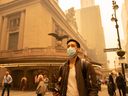 A person wears a face mask as smoke from Canadian wildfires blankets Manhattan on June 7, 2023 in New York City.