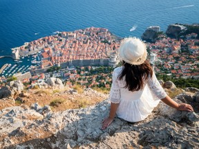 Tourist looking at Dubrovnik's landscape