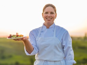 Metis chef Jennifer Lessard holding a dish