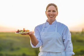 Metis chef Jennifer Lessard holding a dish