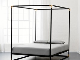 A canopy bed helps to create a “room within a room.” Frame Black Iron Canopy Bed, from $1,100, CB2.ca