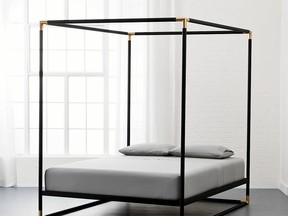 A canopy bed helps to create a “room within a room.” Frame Black Iron Canopy Bed, from $1,100, CB2.ca