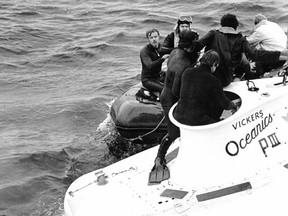 Divers assist rescued crew from Pisces III.