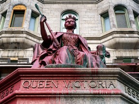 A vandalized statue of Queen Victoria is seen on the McGill University campus in Montreal on Thursday, March 18, 2021.