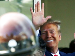 Former U.S. President Donald Trump waves