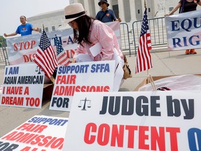 Anti-affirmative action activists with the Asian American Coalition for Education protest outside the U.S. Supreme Court Building on June 29, 2023 in Washington, D.C.