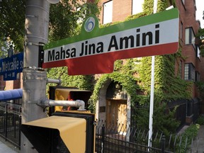 A commemorative sign to Mahsa Amini in Ottawa.