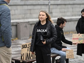 FILE - Climate activist Greta Thunberg arrives at the weekly Fridays for Future demonstration at the Mynttorget square next to the Swedish Parliament Riksdagen, in Stockholm, Sweden, on Nov. 11, 2022. Thunberg said Friday June 9, 2023 she will no longer be able to skip classes as a way to draw attention to climate change because she is graduating from high school.
