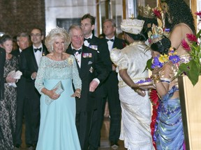Charles and Camilla arriving at dinner