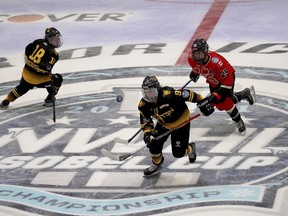 Boston Pride forward Tori Sullivan (9) makes a play for the puck ahead of Toronto Six defender Emma Greco (25) during the first period of a WNHL hockey playoff game, in Boston, Saturday, March 13, 2021. The Professional Hockey Federation and the Professional Women's Hockey Players' Association announced a merger Friday, with an intention of starting a new league in January 2024.