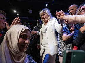 Mississauga Mayor Bonnie Crombie is helped off the stage after a rally in Mississauga, Ont. on Wednesday June 14, 2023, in which she announced her Ontario Liberal Leadership candidacy.