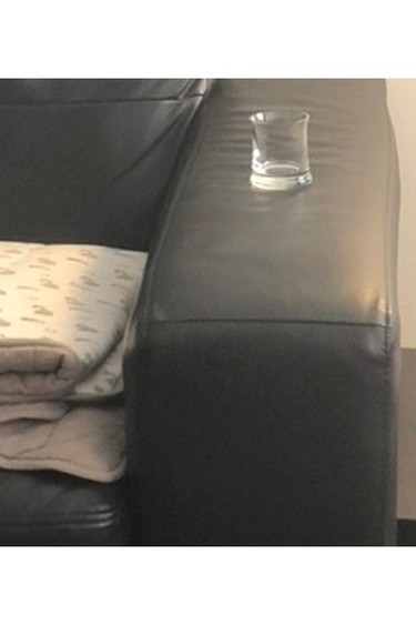 In the days after allegedly sexually abusing his client during a therapy session in June 2020, psychologist Dr. André Dessaulles repeatedly emailed and texted her in an attempt to get her back into therapy. He texted this picture of his office couch, with his client's therapy blanket beside an empty shot glass. "Would be so great if you were here," he said in his text.