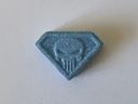 This undated handout photo provided on Wednesday, June 28, 2023 by the Neuhardenberg Police department shows a so-called 'Blue Punisher' ecstasy pill. German police have warned of a potentially lethal 'Blue Punisher' variety of ecstasy in circulation after the death of two teenage girls was linked to the drug.