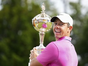 Rory McIlroy reacts with the trophy after winning the Canadian Open at St. George's Golf and Country Club in Toronto on Sunday, June 12, 2022.