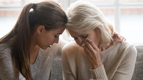 Grownup daughter soothe aged mother holds her hand feeling empathy for her grief. Can grief cause a broken heart?