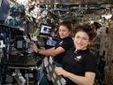 From left, astronauts Jessica Meir and Christina Koch aboard the International Space Station in 2019. The two performed the first women's spacewalk that year.  Koch has since been named to the Artemis 2 lunar mission crew.