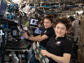 From left, astronauts Jessica Meir and Christina Koch aboard the International Space Station in 2019.
