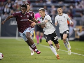 Colorado Rapids defender Moise Bombito (64) and San Jose Earthquakes forward Benji Kikanovic (28) in the first half of an MLS soccer match in Commerce City, Colo., on June 3, 2023