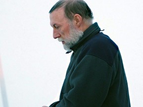 Catholic priest Eric Dejaeger leaves an Iqaluit, Nunavut courtroom Jan. 20, 2011