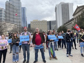 FILE - Advocates gather for a rally at the state Capitol complex in Nashville, Tenn., to oppose a series of bills that target the LGBTQ community, Tuesday, Feb.  14, 2023. Bans on gender-affirming care for minors are to take effect Saturday in Georgia and Tennessee.